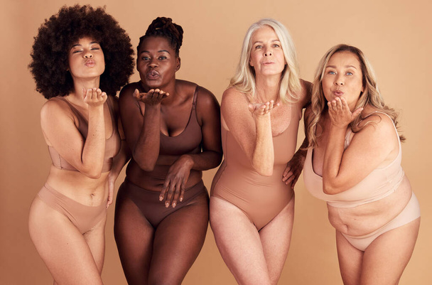 Women, body and different shape group blowing a kiss in studio for lingerie, beauty and diversity wearing underwear. Portrait of female friends together for body positivity, inclusion and self love. - Photo, Image