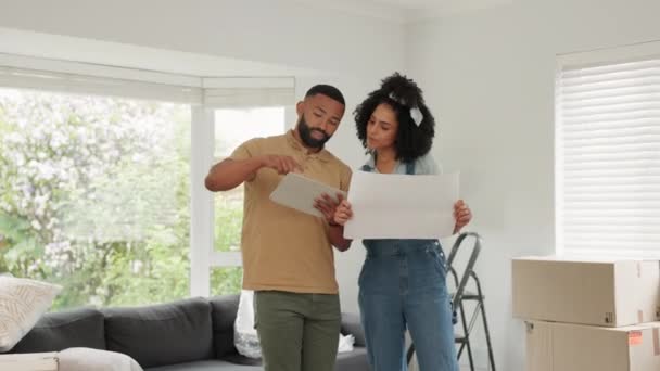 Black couple, real estate and tablet for interior planning, new home or decor together at the house. Man and woman homeowners working on floor plan, touchscreen or home design in renovation or repair. - Footage, Video