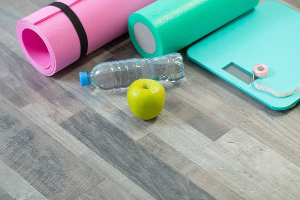 fitness mat on wooden floor, concept of health and sport - Φωτογραφία, εικόνα