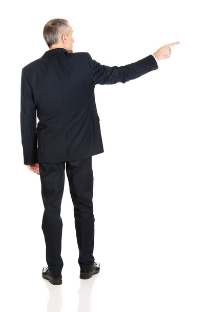 Businessman pointing to the right - Foto, Bild