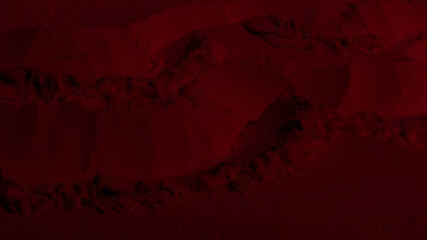 Red texture. Powder background. Pedra, sand. Red color. Dark red. Intense dark red. Cracks, waves, lines, circles, depressions. convex. Banner, advertising, for inscription - Photo, image