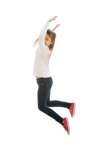 Girl jumping with joy - Foto, afbeelding