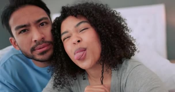 Comic face, selfie and funny couple in love together in their home, house or bedroom. Goofy, silly and playful man and woman in partnership, trust and romance or crazy, fun joke or humor, meme or gag. - Footage, Video