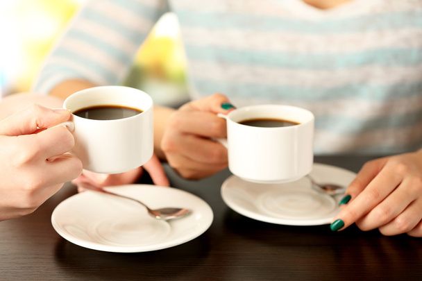 Two women with cups of coffee - Zdjęcie, obraz