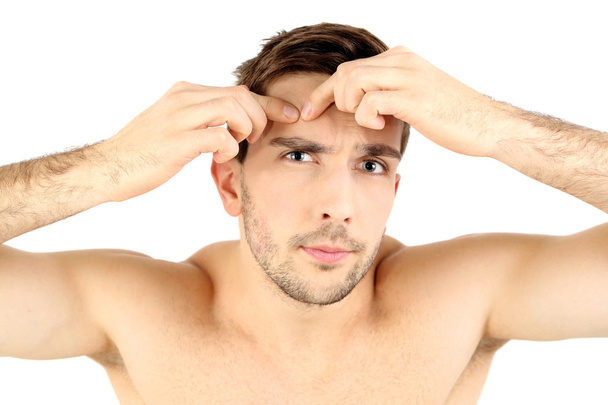 young man squeezing pimple - Photo, image