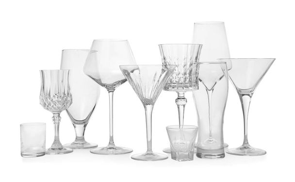 Different elegant empty glasses isolated on white - Foto, Imagem