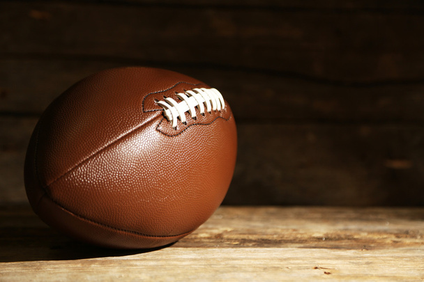 American football on wooden table, close up - Foto, immagini