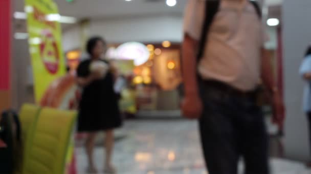 abstrakte Unschärfe Hintergrund von Einkaufszentrum und Menschenmenge zu Fuß Rolltreppe im Einkaufszentrum mit Bokeh - Filmmaterial, Video