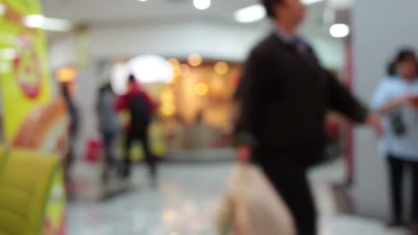 fondo difuminado abstracto de centro comercial y multitud de personas caminando utilizan escaleras mecánicas en el centro comercial centro comercial con bokeh
 - Metraje, vídeo