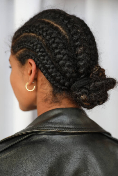 Cropped portrait of pretty young woman with braids back view. Vertical mock-up. High quality photo. - Фото, зображення
