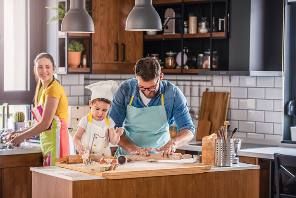 family cooking together, mother, father and son - Foto, Imagem