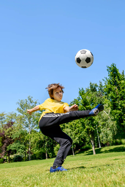 little boy soccer player on a field  - Fotó, kép