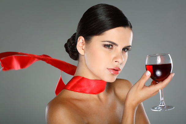 Beautiful young girl with glass of wine - Foto, Imagen