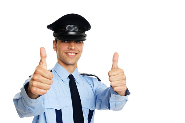 Policeman gesturing thumbs up sign - Fotoğraf, Görsel