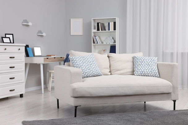 Stylish living room with comfortable sofa. Beautiful interior - Φωτογραφία, εικόνα