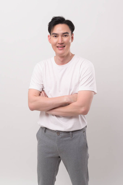 Portrait of young asian man over white background studio. - Φωτογραφία, εικόνα