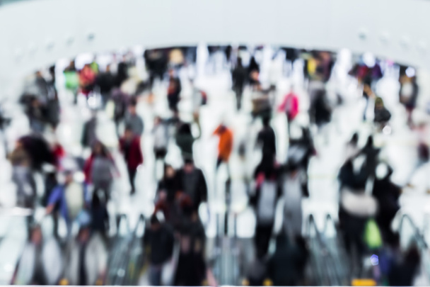 Motion blurred crowded people shopping in mall - 写真・画像