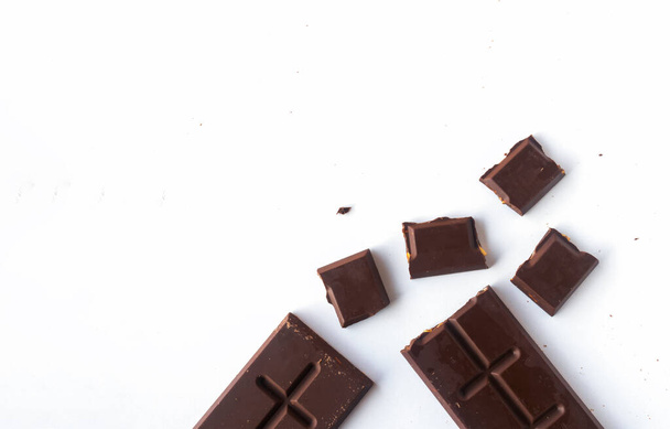 Flat lay composition with delicious chocolate on white table background - Photo, Image