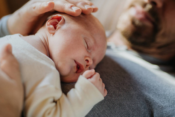 Close-up of father cuddling his little new born baby. - Valokuva, kuva