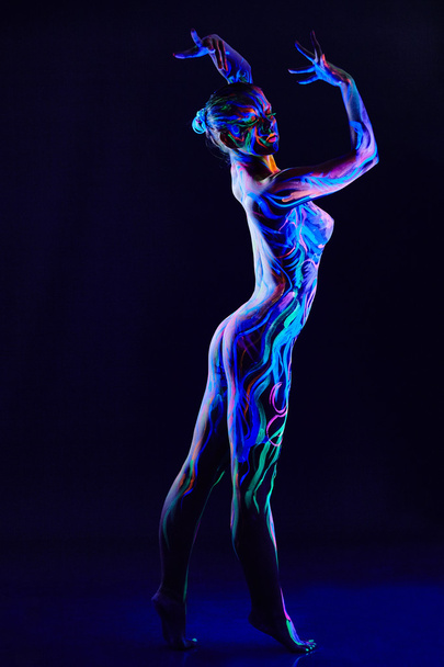 Graceful nude dancer with glowing body art - Foto, immagini