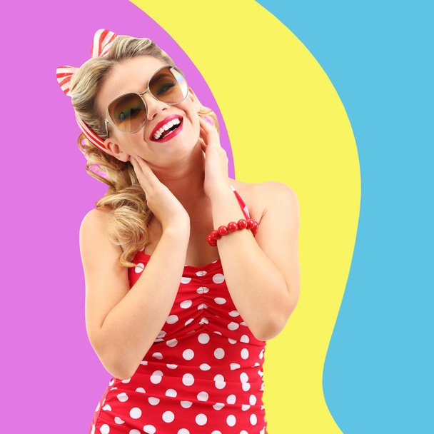 Beautiful girl with pretty smile in pinup style on colorful background - Фото, зображення