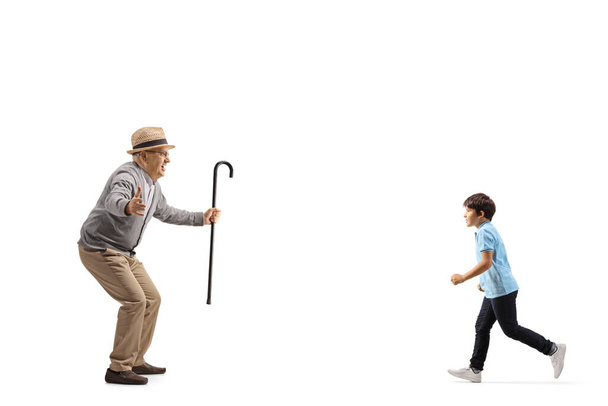 Grandson running towards his grandfather isolated on white backgroun - Foto, Imagen