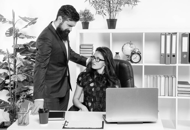 More work and less play. Boss look at unhappy office manager. Professional couple. Man and woman at workplace. Work is important. - Foto, Imagen