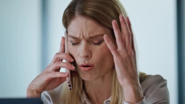 Stressed entrepreneur calling phone at workroom closeup. Shocked manager solving work problems saying oh no at office portrait. Confused businesswoman facepalming at cabinet. Project crisis concept  - Footage, Video
