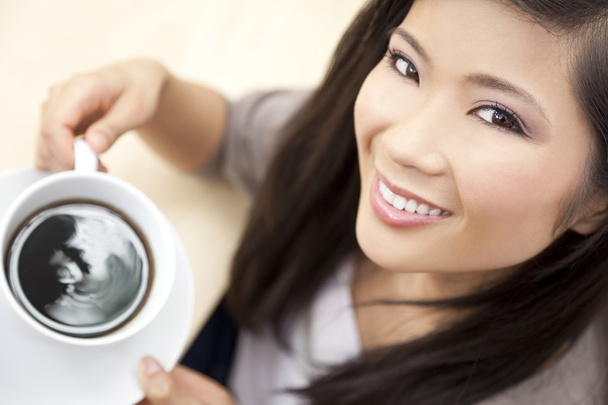 Beautiful Chinese Oriental Asian Woman Drinking Tea or Coffee - Fotó, kép