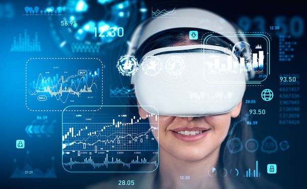 Smiling businesswoman working in vr glasses, stock market graphs hud, chart and numbers. Glowing hologram with lines, worldwide data and financial analysis. - Fotografie, Obrázek