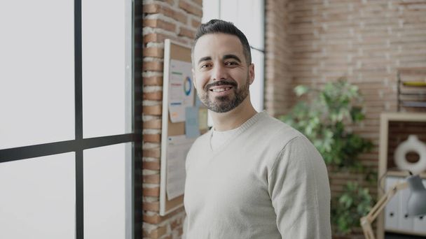 Young hispanic man business worker smiling confident at office - Foto, Imagem