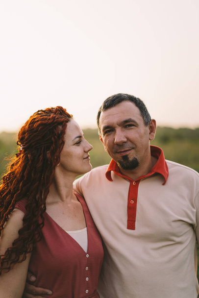 Portrait of a happy couple, woman and man. An adult married couple. Concept of love - Photo, Image