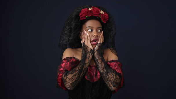 African american woman wearing katrina costume standing with surprise expression over isolated black background - Φωτογραφία, εικόνα