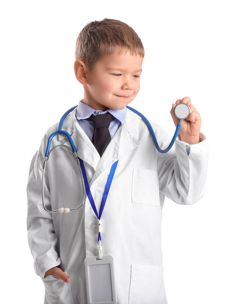 Cute little doctor with stethoscope on white background - Photo, Image