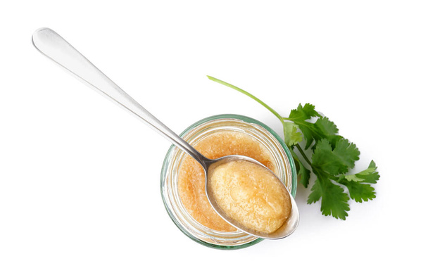 Jar with caviar of capelin, spoon and parsley isolated on white background - Photo, Image