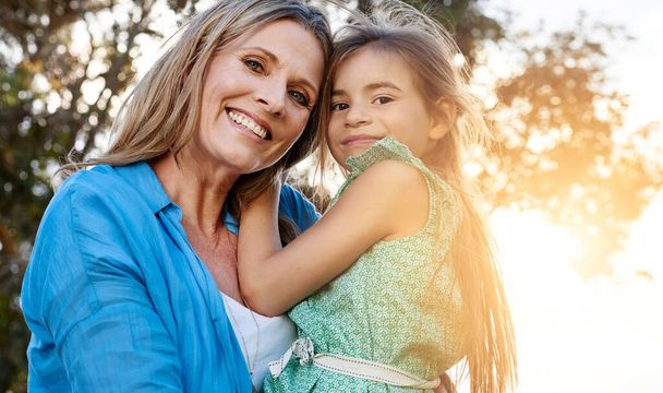 Theres no other love like a mothers love. Portrait of a happy mother and daughter spending time together outdoors - Foto, Imagen