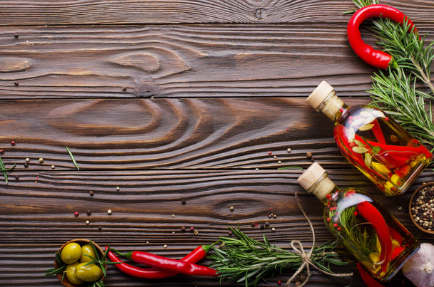 Flat lay Food background frame made of oils condiments and spices on kitchen table. Cooking concept with copy-space - 写真・画像