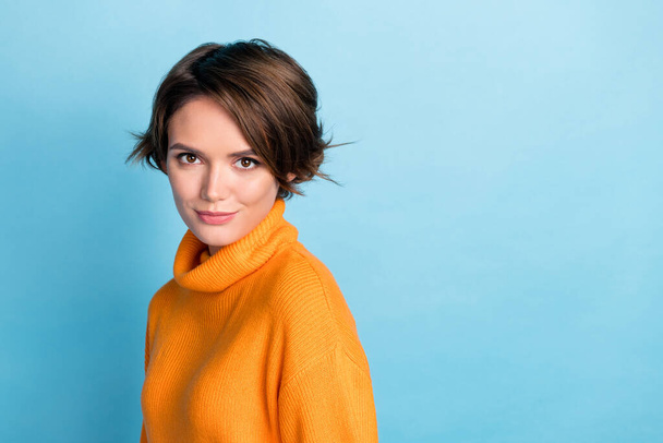 Photo portrait of pretty young girl lovely attractive face model banner dressed stylish orange clothes isolated on blue color background. - Fotó, kép