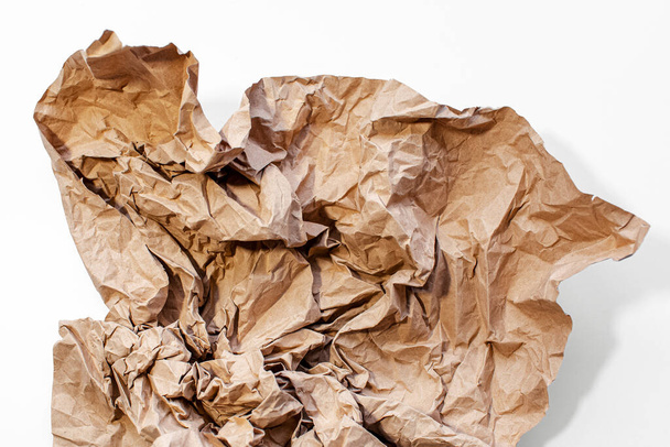 Crumpled paper of beige color isolated on white background. - Fotoğraf, Görsel
