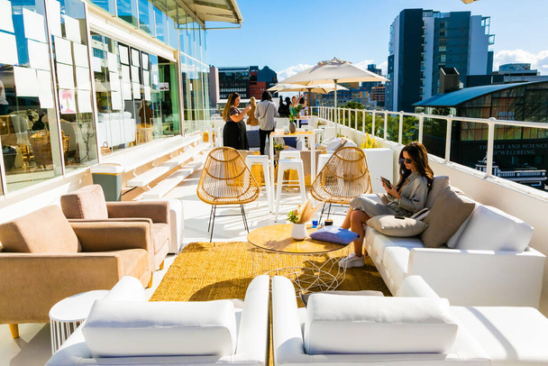 Cape Town, South Africa - November 15, 2022: Outdoor patio furniture on rooftop venue - Foto, immagini