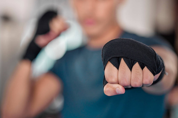 Man, fist and boxing, fitness and martial arts in gym, exercise and power, strong person and punch. Workout, male boxer training in combat and sports, athlete ready to fight and mma fighter hand zoom. - Foto, Imagen