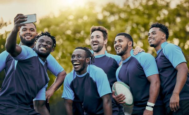 Rugby, team and sports selfie for profile picture, vlog or social media post together. Sporty man holding smartphone smiling in teamwork for group photo, memory or friendship outdoors. - Fotoğraf, Görsel