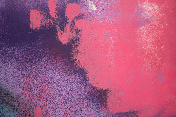 Pink, magenta, white painted plaster wall surface background with colorful drips, flows, streaks of paint and paint sprays - 写真・画像