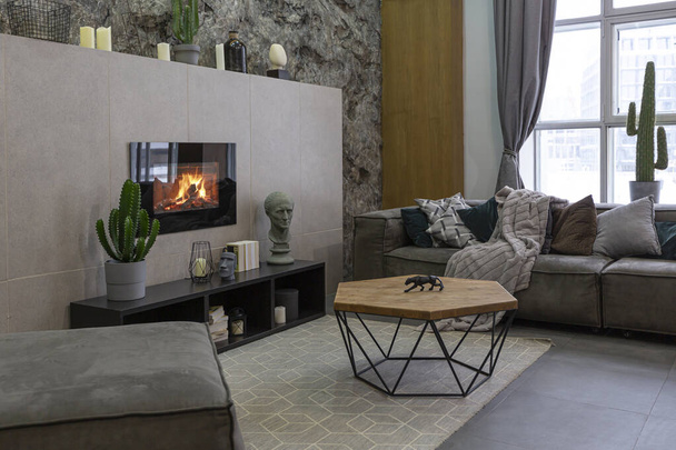 modern studio interior with decorative stone walls in grey. stone wood, tiles and led lighting in the design of the room - Φωτογραφία, εικόνα