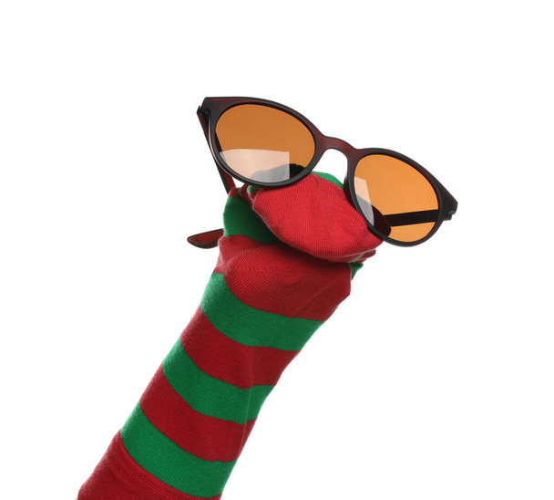 Funny sock puppet with sunglasses isolated on white - Fotó, kép
