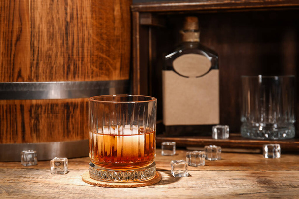 Glass of cold rum on table - Фото, зображення