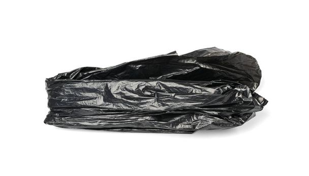 Crumpled Garbage Bag Isolated. Wrinkled Trash Package, Used Plastic Bin Bags, Black Polyethylene Waste Container on White Background - Foto, Imagem