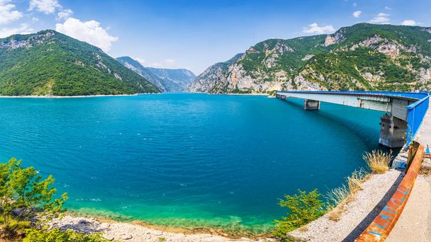 Wide angle panorama view of Piva lake Pivske Jezero in Montenegro at summer noon - Foto, immagini
