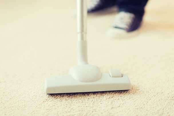 close up of male hoovering carpet - Foto, Imagem