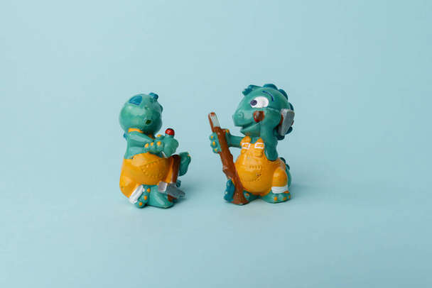 Tyumen, Russia-February 15, 2023: Figures of dinosaur builders. Hobby. Kinderfilia - collecting childrens toys and souvenirs from kinder surprise. - Photo, Image